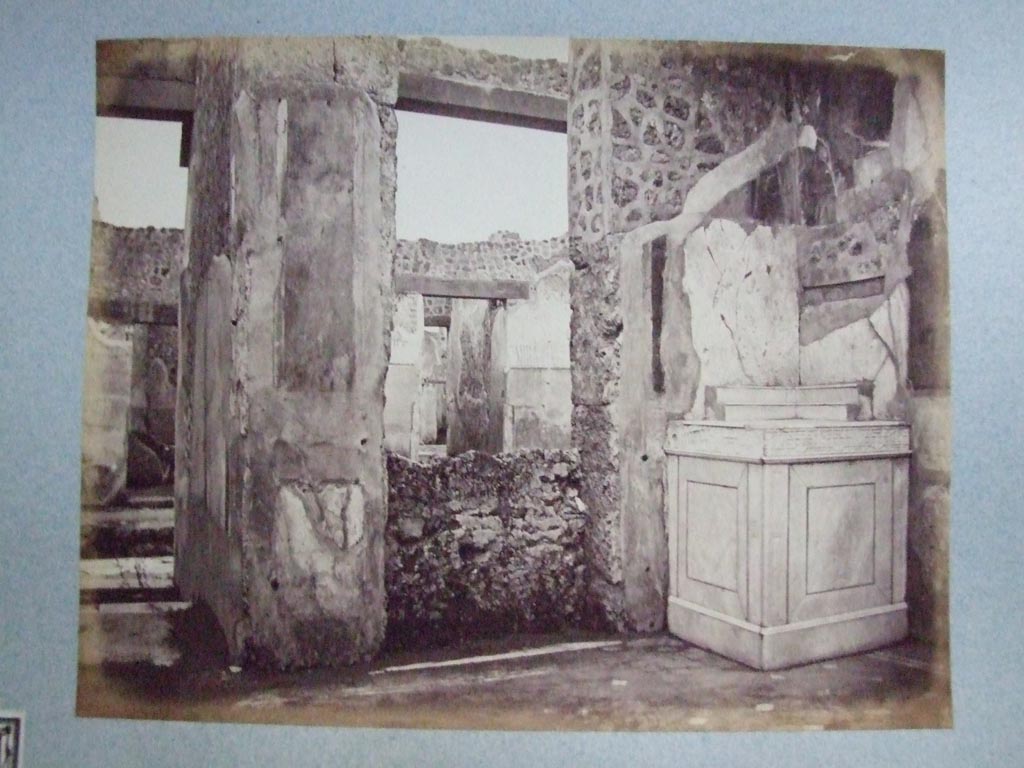 V.1.26 Pompeii.  Altar with slab showing Forum during the earthquake of 62 AD.  Old undated photograph courtesy of the Society of Antiquaries, Fox Collection.
