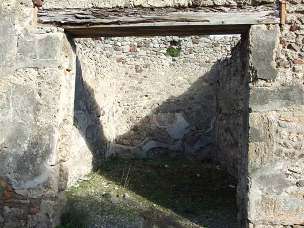 V.2.7 Pompeii. December 2007. 
Doorway to room 14, looking east. In the north-west corner of this room a pile of lime was discovered. 
