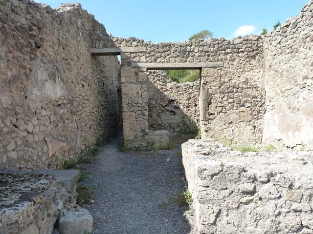 V.2.13 Pompeii,  March 2009.  South west corner, and base of stairs to upper floor.
