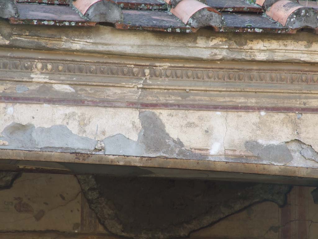 V.2.i Pompeii. December 2007. Room 23, details of painted lintels and plaster stucco in Rhodian peristyle.  