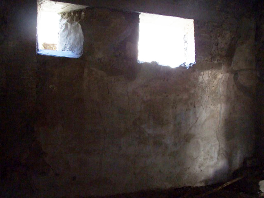 V.2.i Pompeii. March 2009. Room 2, north wall with two small windows onto Vicolo delle Nozze d’Argento.