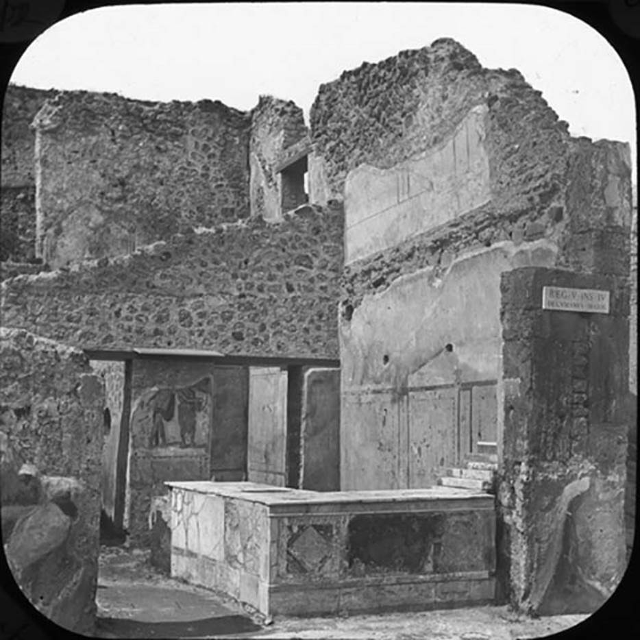 V.4.7 Pompeii. Photo by York and Son, in or before 1890. Looking north to entrance on Via Nola.  NB, note the extensive upper floor walls.  Used with the permission of the Institute of Archaeology, University of Oxford. File name instarchbx202im 072. Source ID. 44541.
