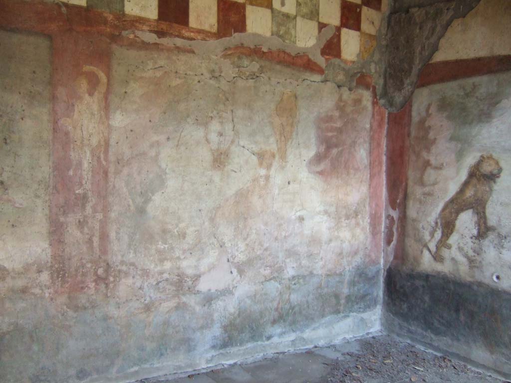 V.4.a Pompeii. May 2006. Room ‘l’ (L), hunting fresco with life-size animals on east wall in south-east corner wall of garden area.