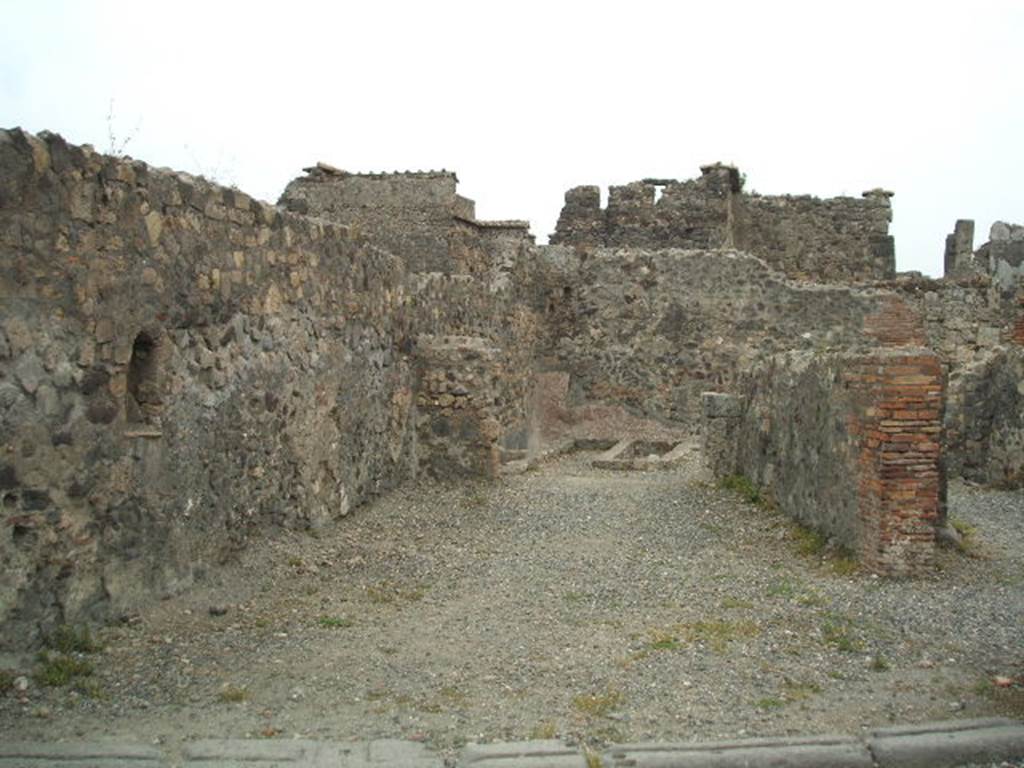 VI.1.14 Pompeii. September 2004. Looking east across main room to rear.
