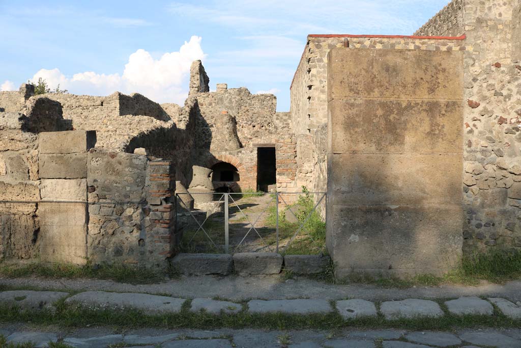 VI.2.6 Pompeii. December 2018. Looking east on Via Consolare towards entrance doorway. Photo courtesy of Aude Durand.