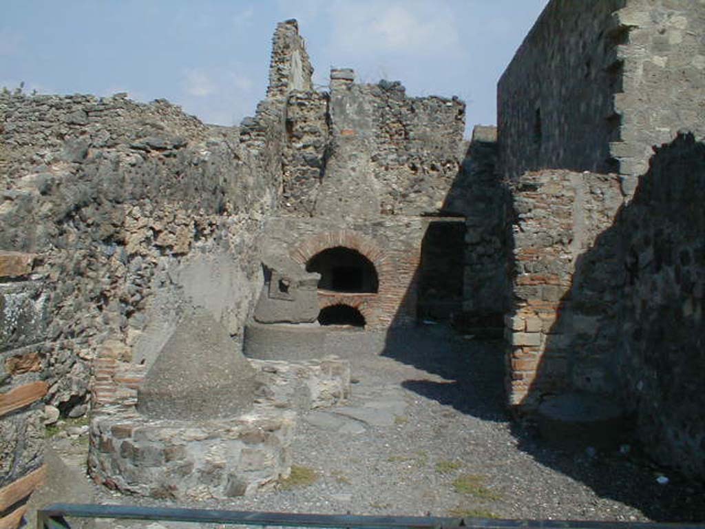VI.2.6 Pompeii. September 2004. Looking east to 3 mills and oven.