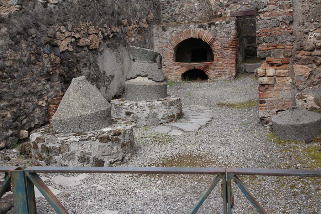 VI.2.6 Pompeii. April 2014. Looking east towards mills and oven, and doorway to rear room.
Photo courtesy of Klaus Heese.
