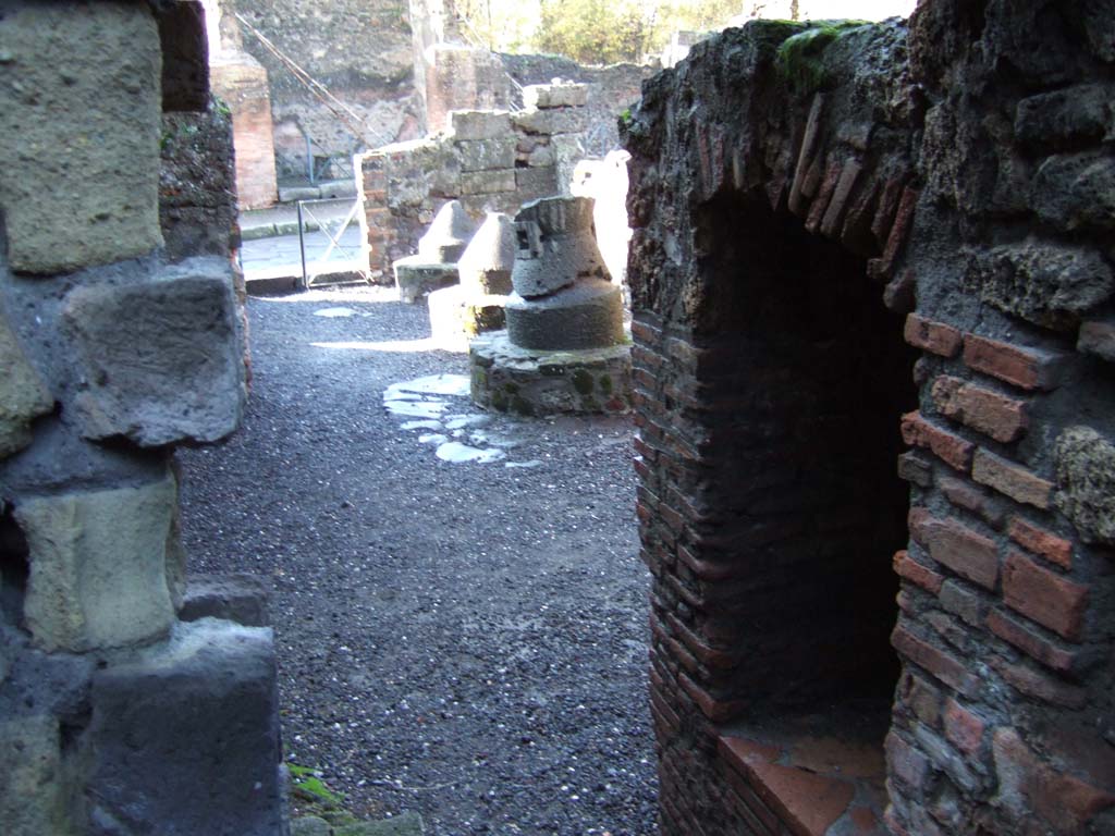 VI.2.6 Pompeii. December 2005. Looking west from rear towards Via Consolare, with the side window of the oven on the right.