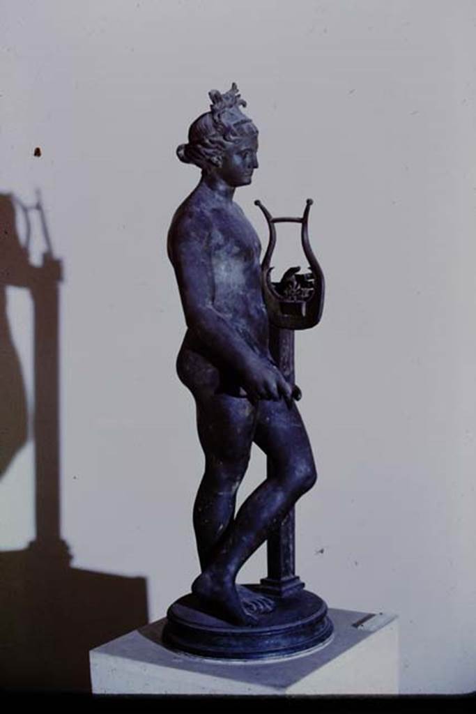 VI.2.22 Pompeii, 1968.  Bronze statuette of Apollo, found on north colonnade of peristyle, but probably originally from the aedicula lararium in the middle of the south wall of the peristyle.  Now in Naples Archaeological Museum, inv. no. 5613.  Photo by Stanley A. Jashemski.
Source: The Wilhelmina and Stanley A. Jashemski archive in the University of Maryland Library, Special Collections (See collection page) and made available under the Creative Commons Attribution-Non Commercial License v.4. See Licence and use details.  J68f1397

