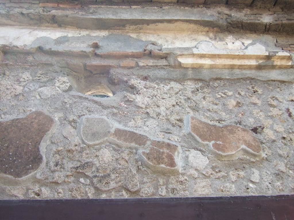 VI.2.22 Pompeii. December 2007.  Painted wall decoration on west wall of peristyle, above doorway to triclinium.

