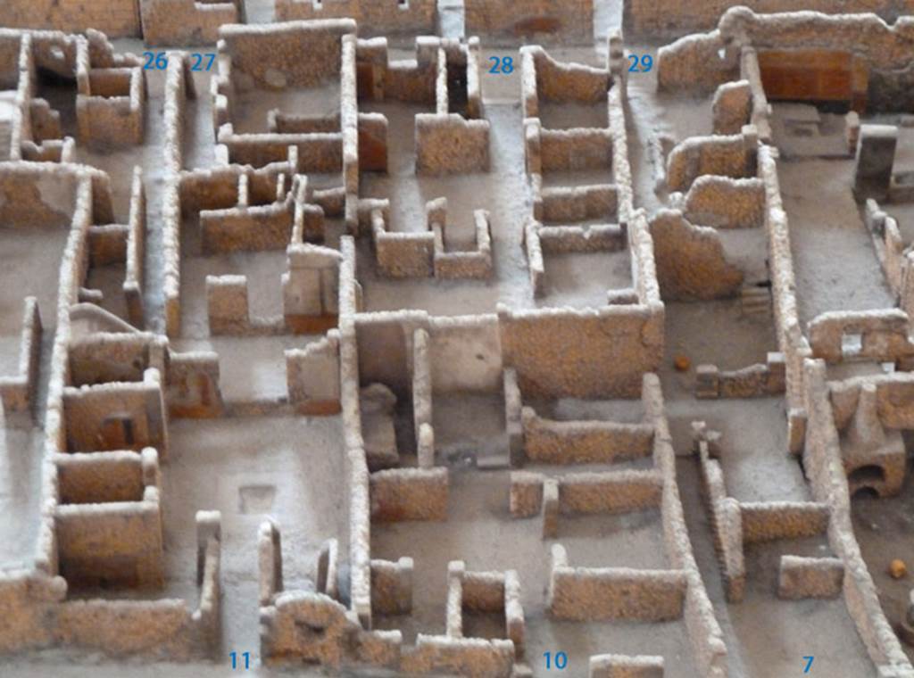 VI.2.27 Pompeii, in top left corner, next to VI.2.26. Viewed from the model in the Naples Archaeological Museum.
