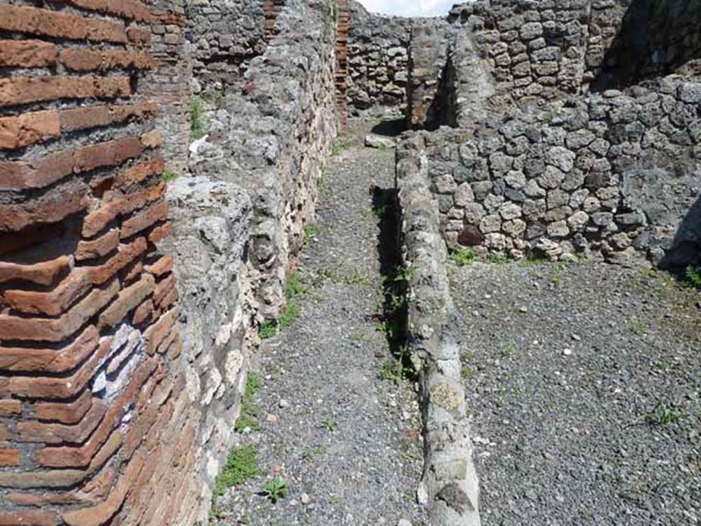 VI.3.10 Pompeii. May 2010. Passageway to rear on south side of workshop.