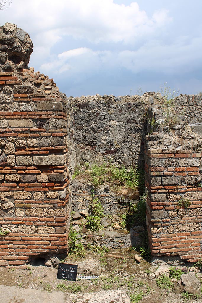 VI.5.11 Pompeii. June 2023. Stairs to an independent dwelling on the upper floor.
Photo courtesy of Jessica Mingoia.
According to CTP, the north-west corner of the house at VI.5.14 was excavated in 1817, as well as the pseudoperistyle of VI.5.10 and atrium area of VI.5.9.
The street wall at the north-west corner of the house at VI.5.14 collapsed and was reconstructed, which may provide the reason why Tascone, Mau and Eschebach, all indicated a rear doorway to VI.5.14, immediately south of this stairway, which, rightfully should be assigned a number. 
This doorway was delineated by Russo’s map of 1817, and later by Mazois, Fiorelli – Sorgente, and Zangemeister (1865). 
Today the number VI.5.11 is not in situ but it has been assigned by the SANP to this staircase. 
See Van der Poel, H. B., 1981. Corpus Topographicum Pompeianum, Part V. Austin: University of Texas, (p.196-7).

