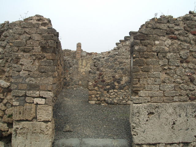 VI.6.14 Pompeii. May 2005. Rear room, south-east corner. According to Eschebach this was a triclinium with a window onto the cubiculum of VI.6.1.
See Eschebach, L., 1993. Gebäudeverzeichnis und Stadtplan der antiken Stadt Pompeji. Köln: Böhlau. (p.175) According to Fiorelli, this rear room served as a dormitory. See Pappalardo, U., 2001. La Descrizione di Pompei per Giuseppe Fiorelli (1875). Napoli: Massa Editore. (p.56)