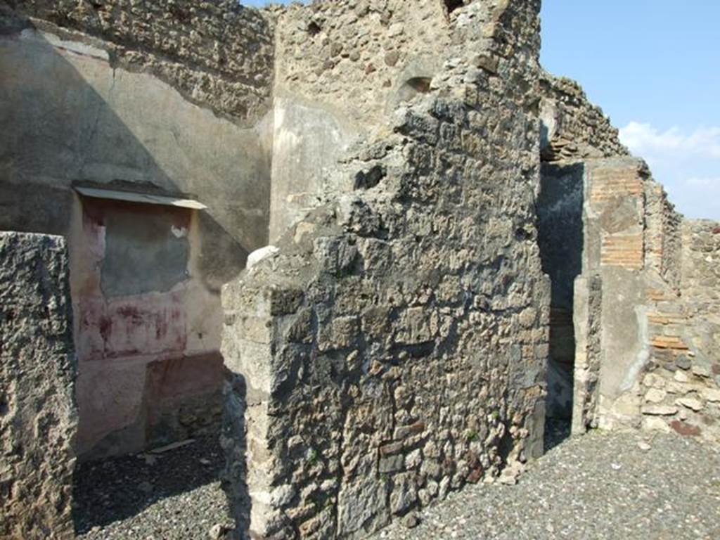 VI.7.3 Pompeii. March 2009. Room 5, tablinum. North wall, with doorway to room 4, and cupboard or small room on east side.
