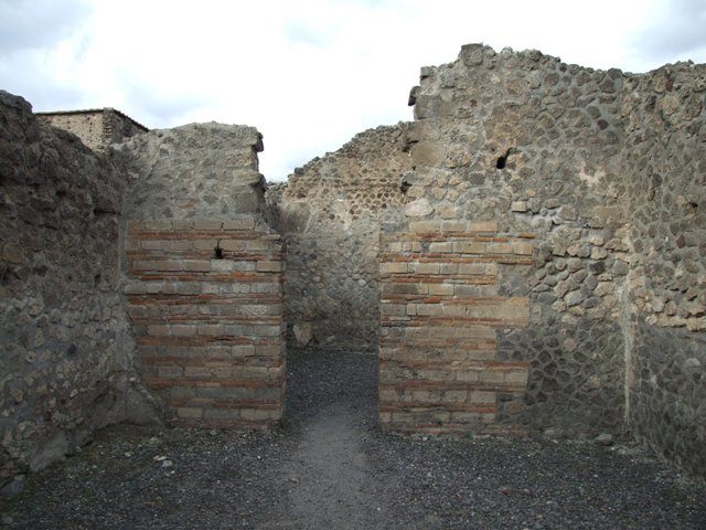 VI.8.11 Pompeii. December 2007. Remains of steps to upper floor in south-east corner of rear room. According to Eschebach, on the right would have been the base of the stairs to the upper floor with three steps remaining
See Eschebach, L., 1993. Gebäudeverzeichnis und Stadtplan der antiken Stadt Pompeji. Köln: Böhlau. (p.184)