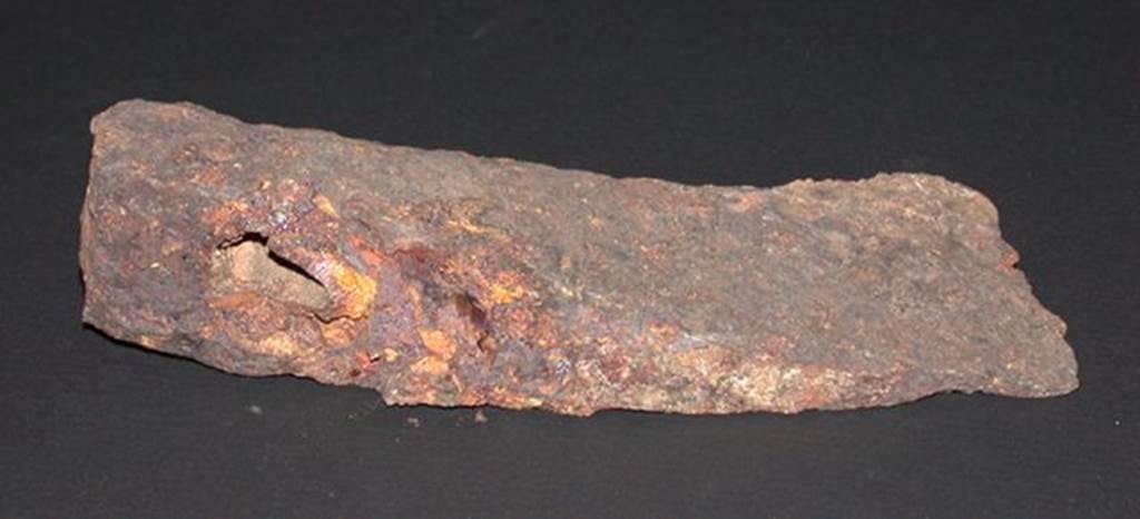 VI.9.1 Iron axe head, front view.  Height 0.033m, width 0.057m, length 0.14m.  OA 2811 Hache, muse Cond, photo RMN  R.G. Ojeda