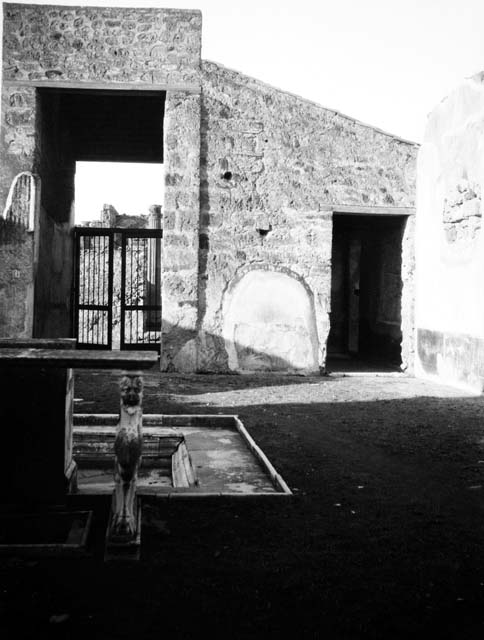 VI.9.2 Pompeii. March 2009. Room 2, atrium and impluvium. Detail of atrium wall between rooms 13 and 14.