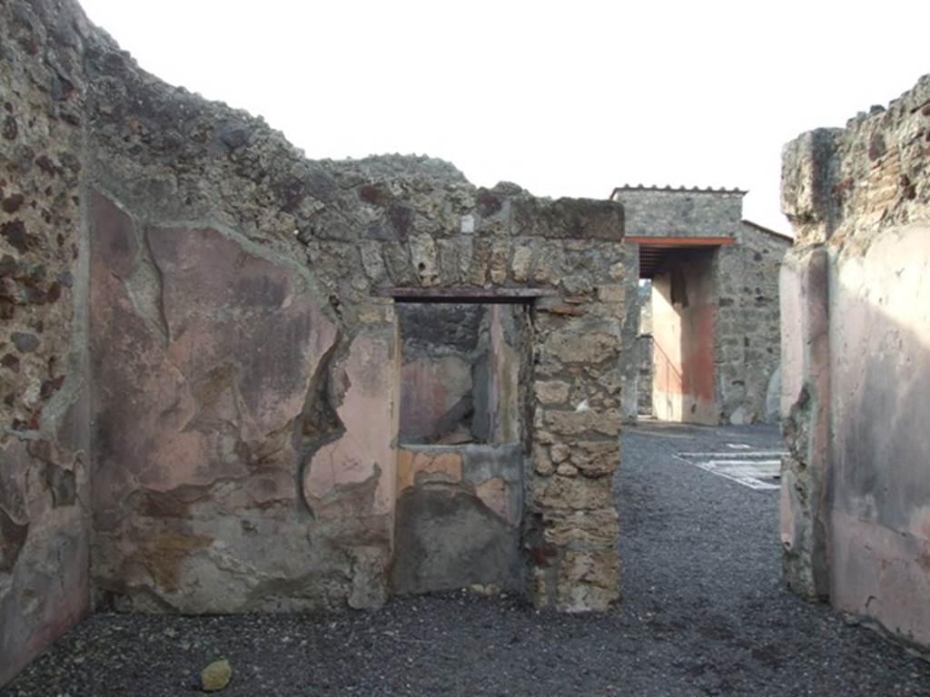 VI.9.2 Pompeii. December 2007. Room 15, triclinium. West wall with niche recess. Looking west towards atrium.