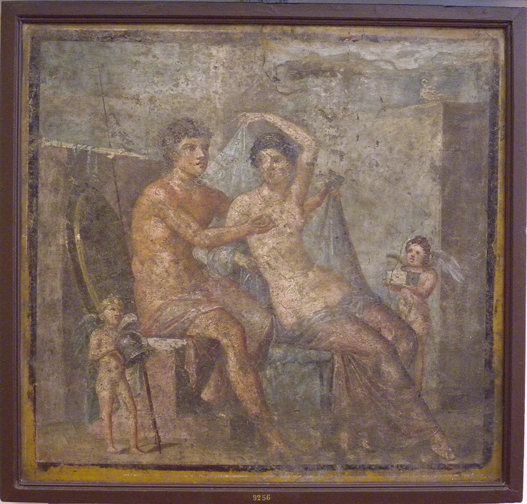 VI.9.2 Pompeii. Found 30th October 1829 in room 8, tablinum from south wall.
Wall painting of Mars and Venus with two cupids who hold the god’s helmet and the goddess’ box.
Now in Naples Archaeological Museum. Inventory number 9256.
See Helbig, W., 1868. Wandgemälde der vom Vesuv verschütteten Städte Campaniens. Leipzig: Breitkopf und Härtel. (318).

