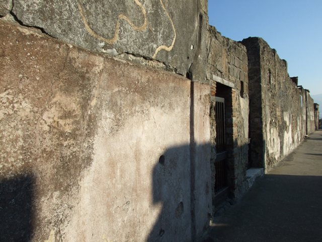 VI.9.4 Pompeii. December 2007. Looking east from entrance into room 15.  
According to Fiorelli, this was a room with a staircase to the upper floor and a separate entrance doorway to the Via. He also said that at some time a servant name Paris wrote his graffito for posterity –
Paris hic
fuit
See Pappalardo, U., 2001. La Descrizione di Pompei per Giuseppe Fiorelli (1875). Napoli: Massa Editore. (p.65) 

Paris was here. (CIL IV 1305)
See Berry, J., 2007. The Complete Pompeii. London: Thames & Hudson. (p.103)
