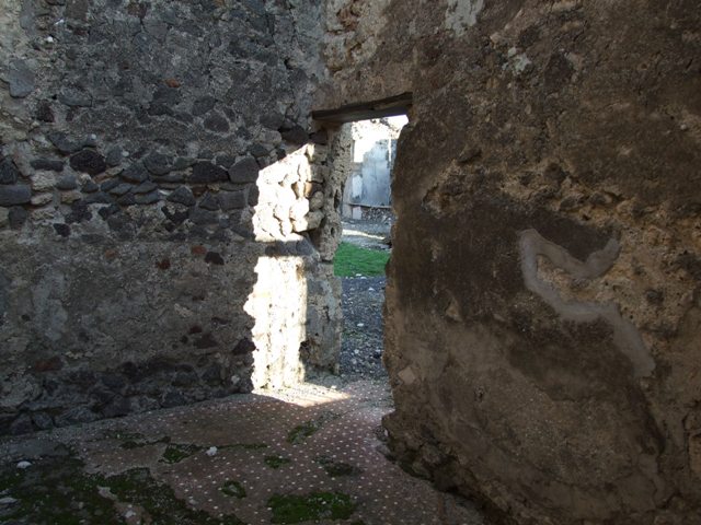 VI.9.4 Pompeii. December 2007. Remains of a terracotta down-pipe from the upper floor rooms in north-west corner of room15  below.