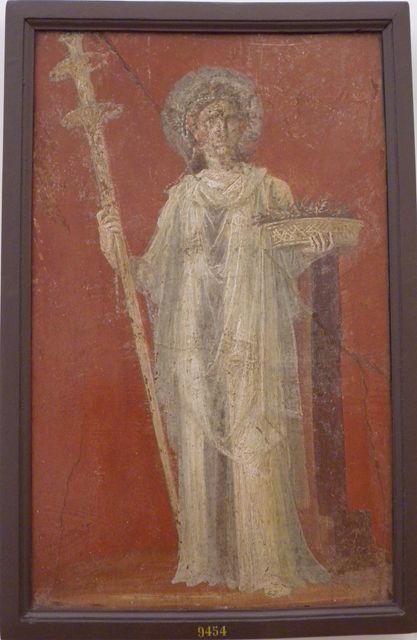 VI.9.6 Pompeii.  Found on 18th June 1828.  Room 4.  Area leading to peristyle.  Wall painting of Ceres holding a long torch and a basket full of ears of grain. One of two paintings that flanked the door in the deep bay that formed a vestibule for the peristyle.  Now in Naples Archaeological Museum.  Inventory number 9454.