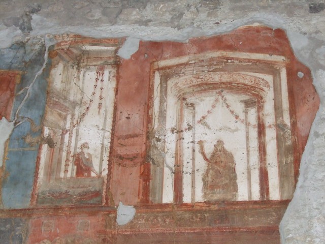 VI.9.6 Pompeii. March 2009. Room 8, painted figures and naval scene, from the upper centre of the north wall.