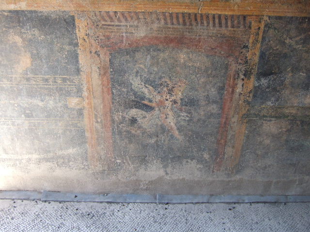 VI.9.6 Pompeii. March 2009. Room 8, painted winged figure, from the dado of the north wall.
