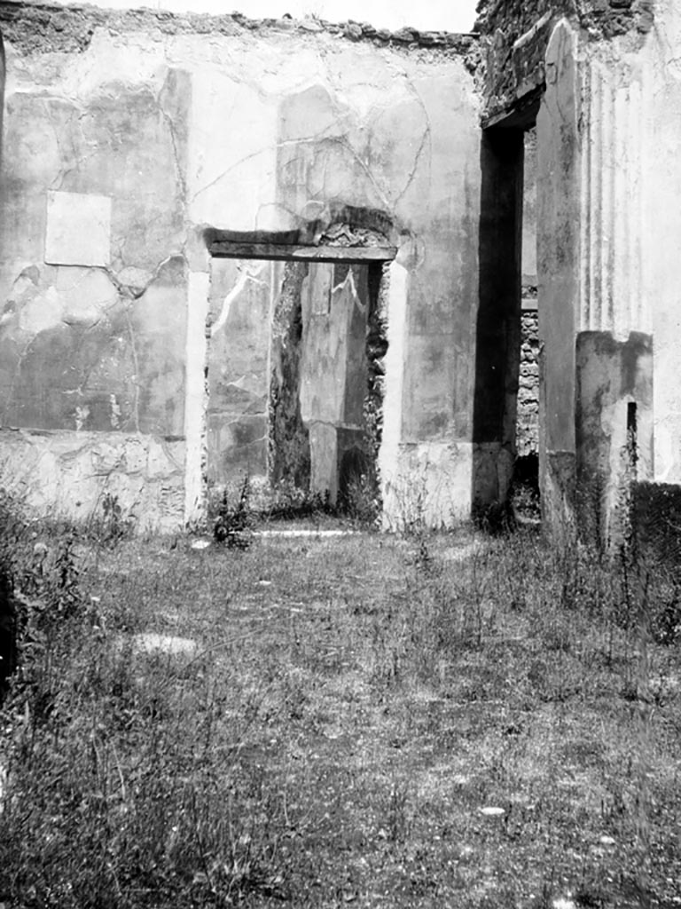 VI.9.6 Pompeii. W.894. Room 17, looking north towards north-west corner of pseudo-peristyle.
The painting below, but now faded and disappeared, would have been seen on the left side of the doorway to room 20.
The doorway to room 20, is in the centre, and doorway leading to kitchen area towards the right. 
Photo by Tatiana Warscher. Photo © Deutsches Archäologisches Institut, Abteilung Rom, Arkiv. 
