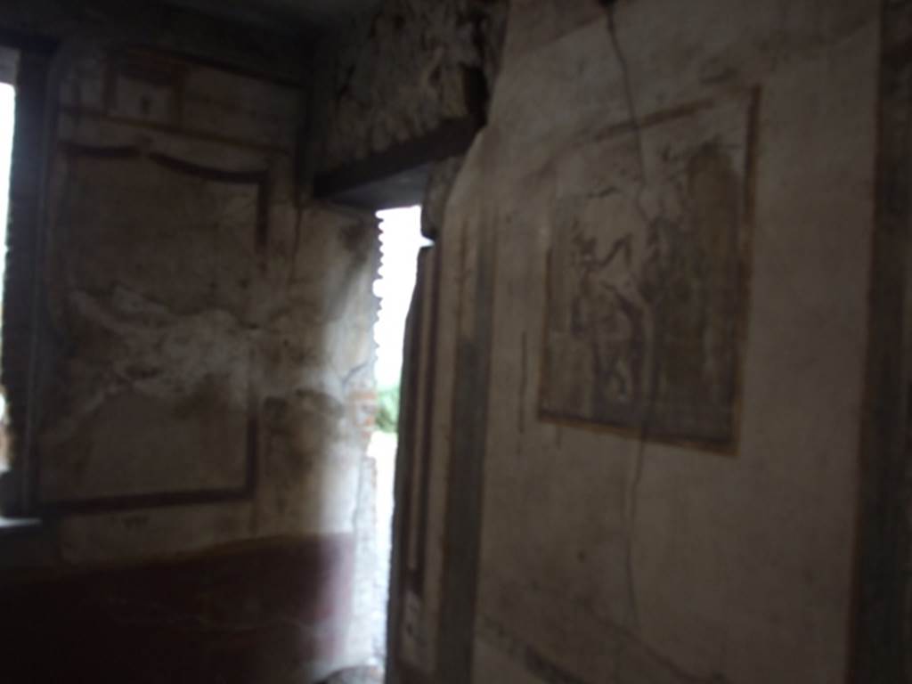 VI.9.6 Pompeii. March 2009. Room 21, south-east corner with doorway to corridor 10.
