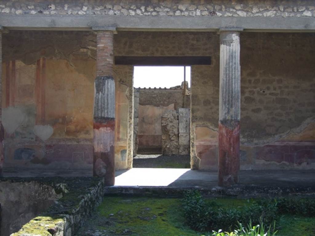 VI.9.6 Pompeii. March 2009. Room 6, south wall of peristyle, with entrance doorway to atrium of VI.9.7. 