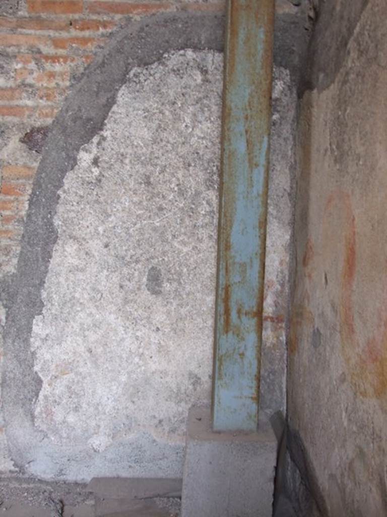 VI.9.7 Pompeii. March 2009. Room 4, remains of painted lararium on west wall, in north-west corner of kitchen.  
