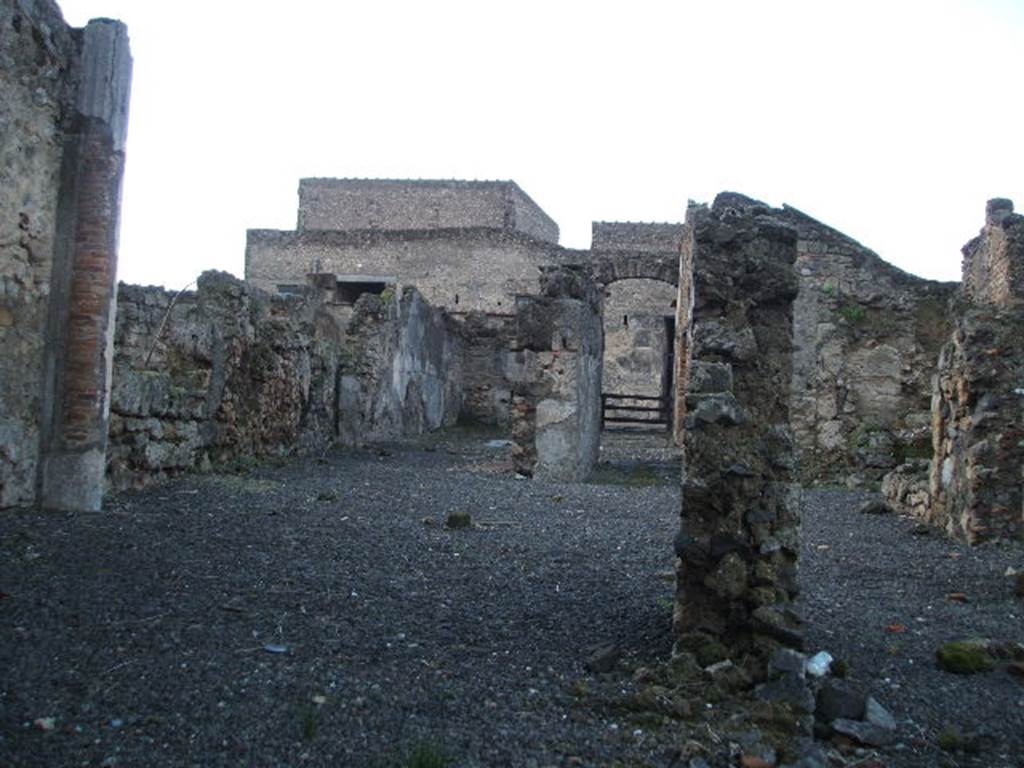 VI.10.2 Pompeii. December 2004. Looking west across garden area towards tablinum and entrance doorway, taken from the triclinium at the rear.
