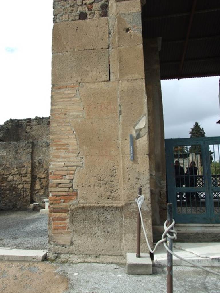 VI.12.1 Pompeii. March 2009. Pilaster on east side of entrance of shop, separating from VI.12.2. For graffiti found on this pilaster, see VI.12.2.
