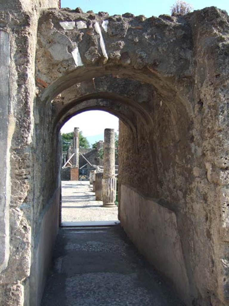 VI.12.2 Pompeii. September 2005. Corridor, on east side of oecus/triclinium, looking south to middle peristyle.
