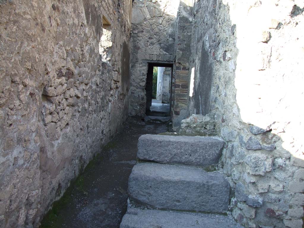 VI.12.2 Pompeii. December 2006. Looking north along corridor 19 towards rear peristyle, and stairs to upper floor.
