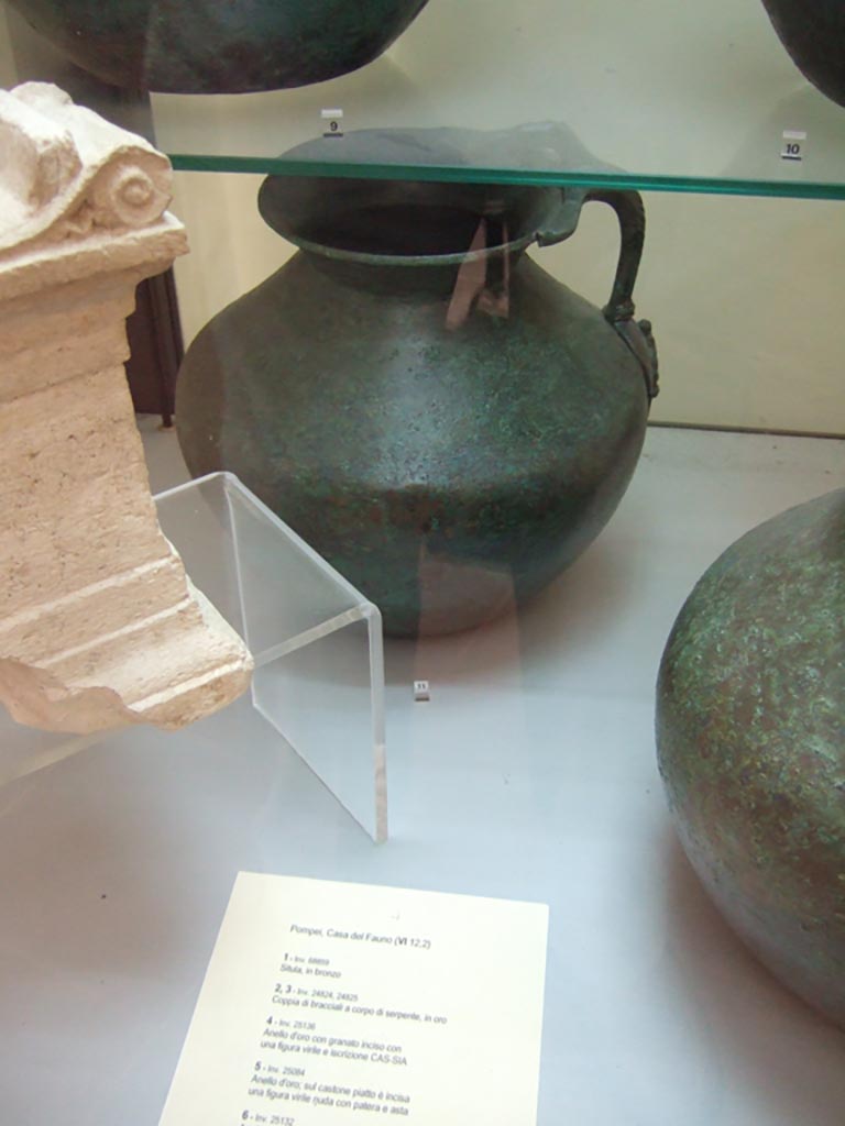 VI.12.2 Pompeii. Found on 5th November 1830. One handled bronze jug. 
Now in Naples Archaeological Museum. Inventory number 69428.
See Fiorelli G., 1862. Pompeianarum antiquitatum historia, Vol. 2: 1819 - 1860, Naples, p. 242-243.
