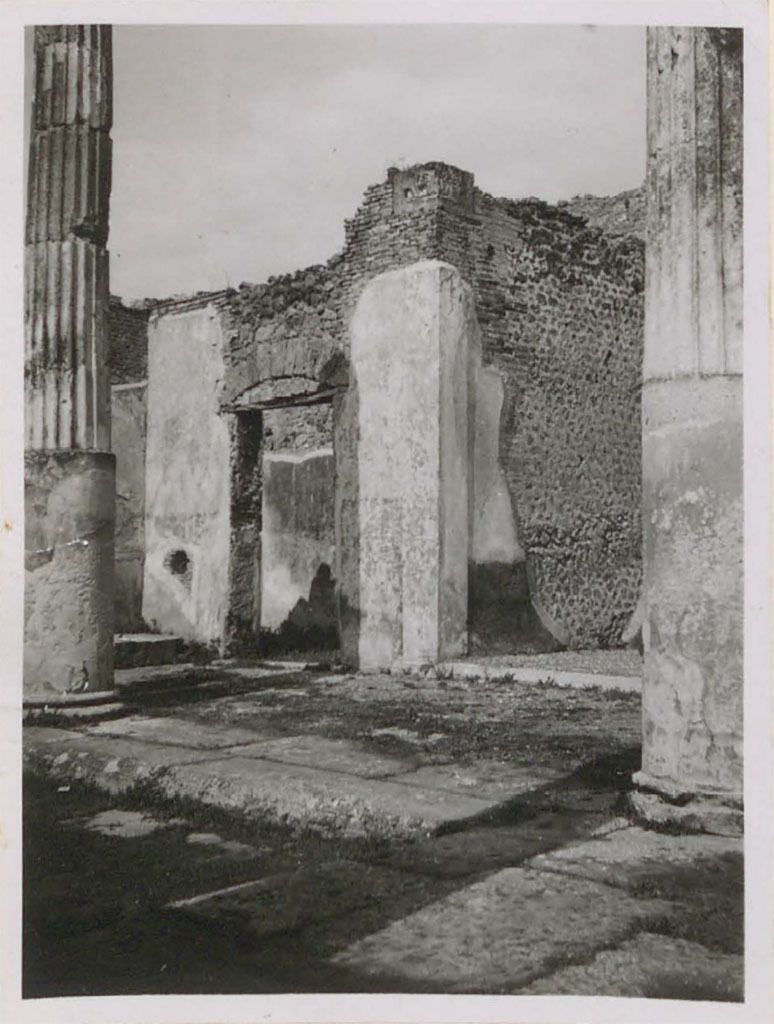 VI.12.5 Pompeii. Pre-1943. 
Looking north-east across tetrastyle atrium 7 and impluvium towards a doorway to a triclinium 15, on north side of east ala 14.
See Warscher, T. (1946). Casa del Fauno, Swedish Institute, Rome. (p.56, n. 79).
