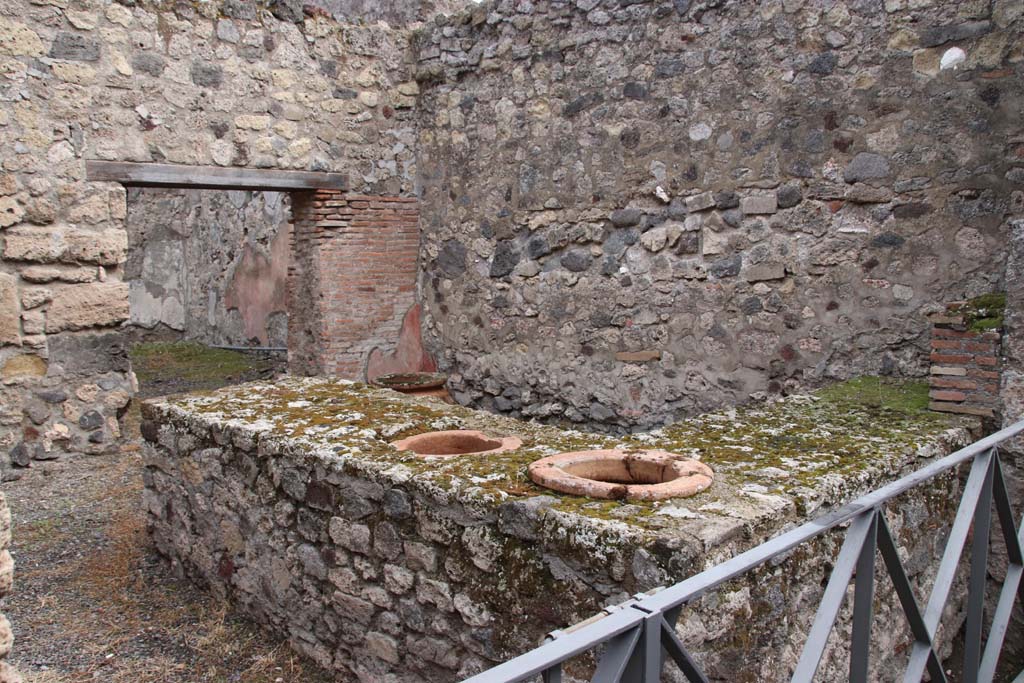 VI.14.36 Pompeii. October 2020. Looking east across two-sided counter with two dolia set in it. Photo courtesy of Klaus Heese.

