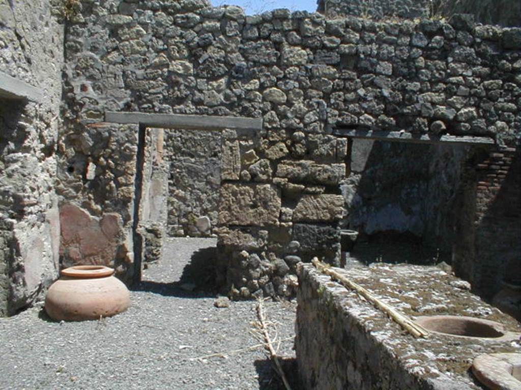 VI.14.36 Pompeii. October 2017. Terracotta pot in north-east corner of bar room, on the right is the doorway into the kitchen. 
Foto Taylor Lauritsen, ERC Grant 681269 DÉCOR.
