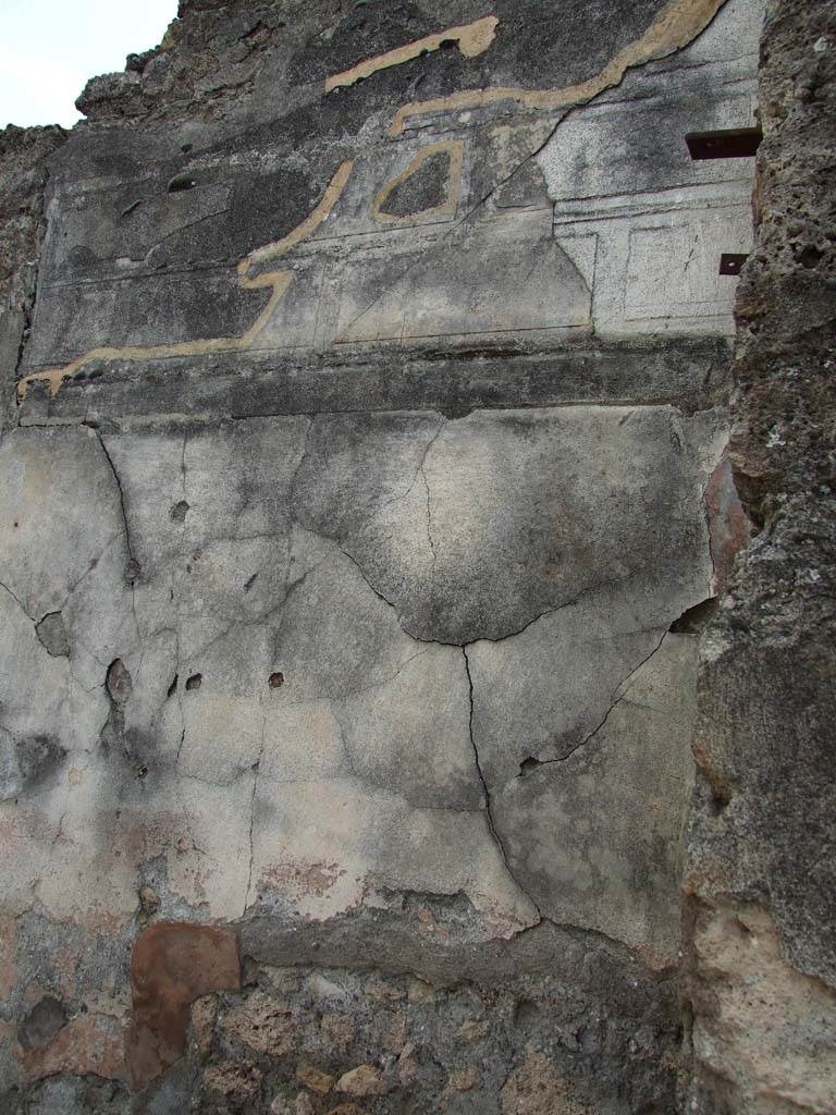 VI.14.43 Pompeii. December 2006. 
Remains of wall plaster on inside right-hand side of entrance vestibule.
