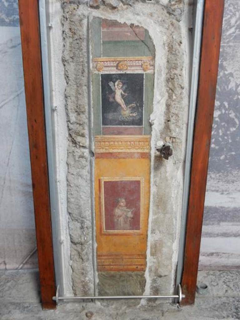 VI.15.1 Pompeii. May 2017. 
Detail of painted panel on south end of west wall of atrium, leading onto peristyle. Photo courtesy of Buzz Ferebee.

