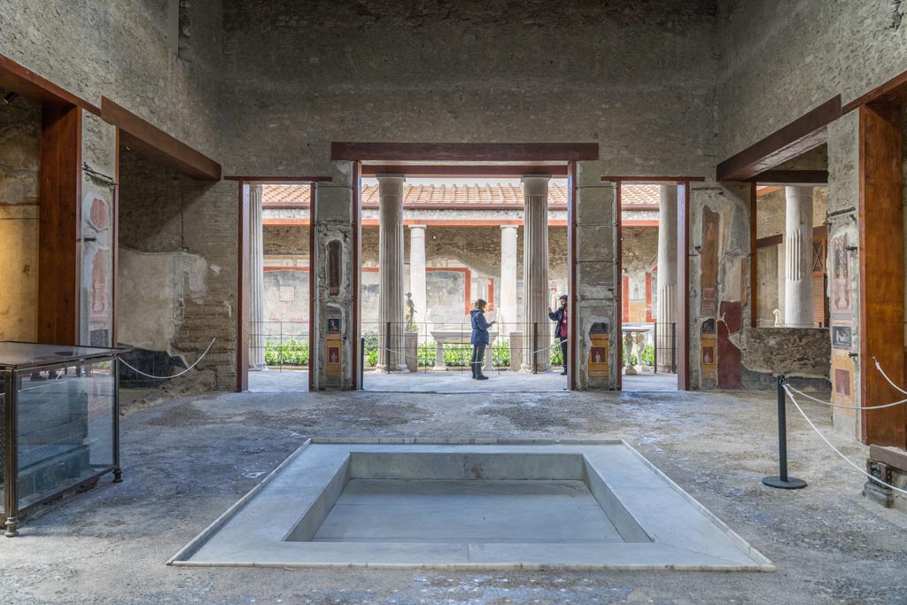 VI.15.1 Pompeii. March 2023. Looking west across impluvium in atrium towards peristyle. Photo courtesy of Johannes Eber.