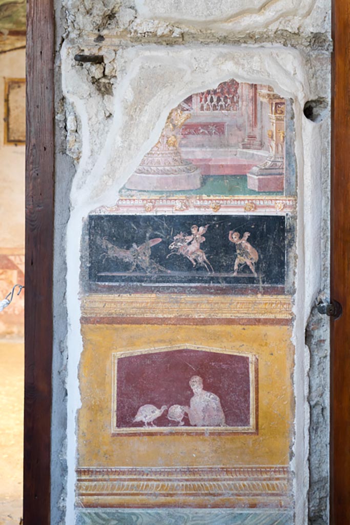 VI.15.1 Pompeii. March 2023. 
Painted panels in atrium between doorways to bedroom on left of main entrance and oecus on south side.
Photo courtesy of Johannes Eber.
