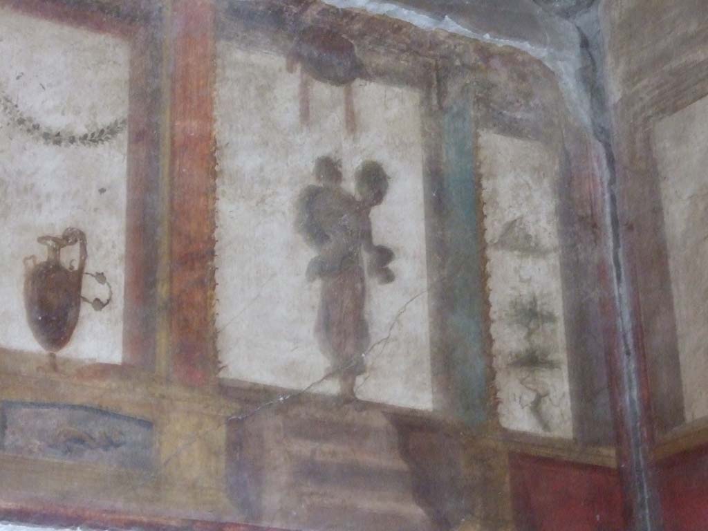 VI.15.1 Pompeii. December 2006. Detail of painting at west end on upper south wall in oecus on south side of atrium.