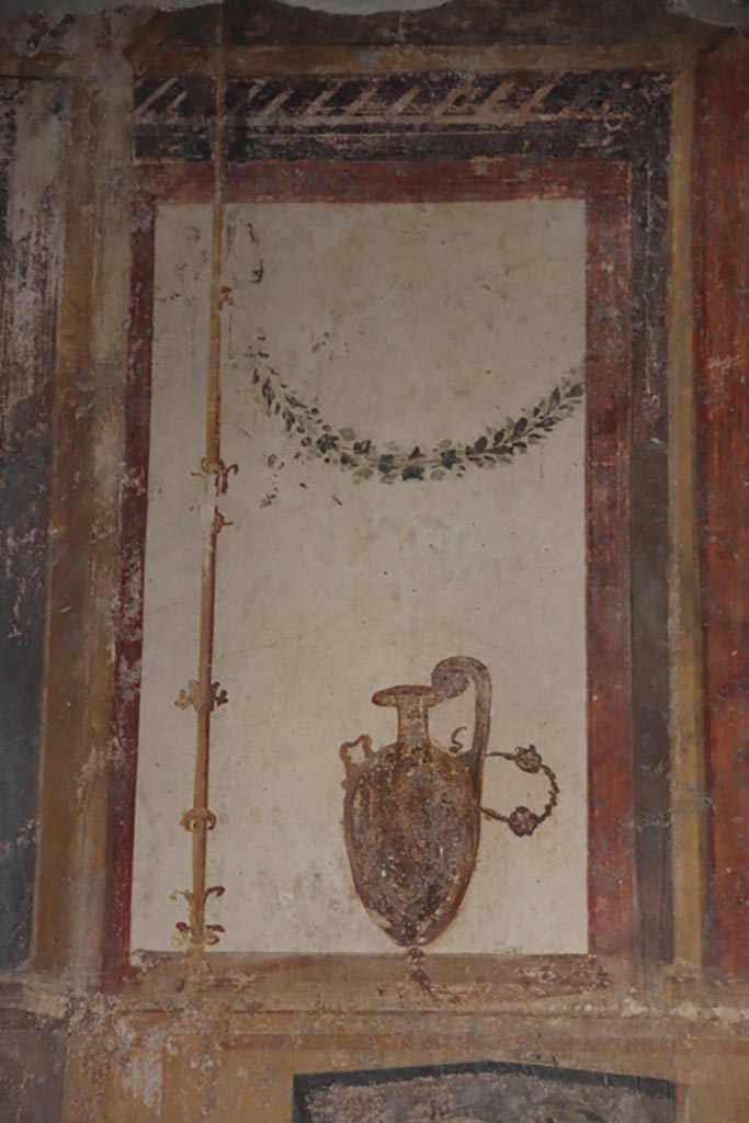 VI.15.1 Pompeii. October 2023. Detail from upper south wall at west end of oecus. Photo courtesy of Klaus Heese.