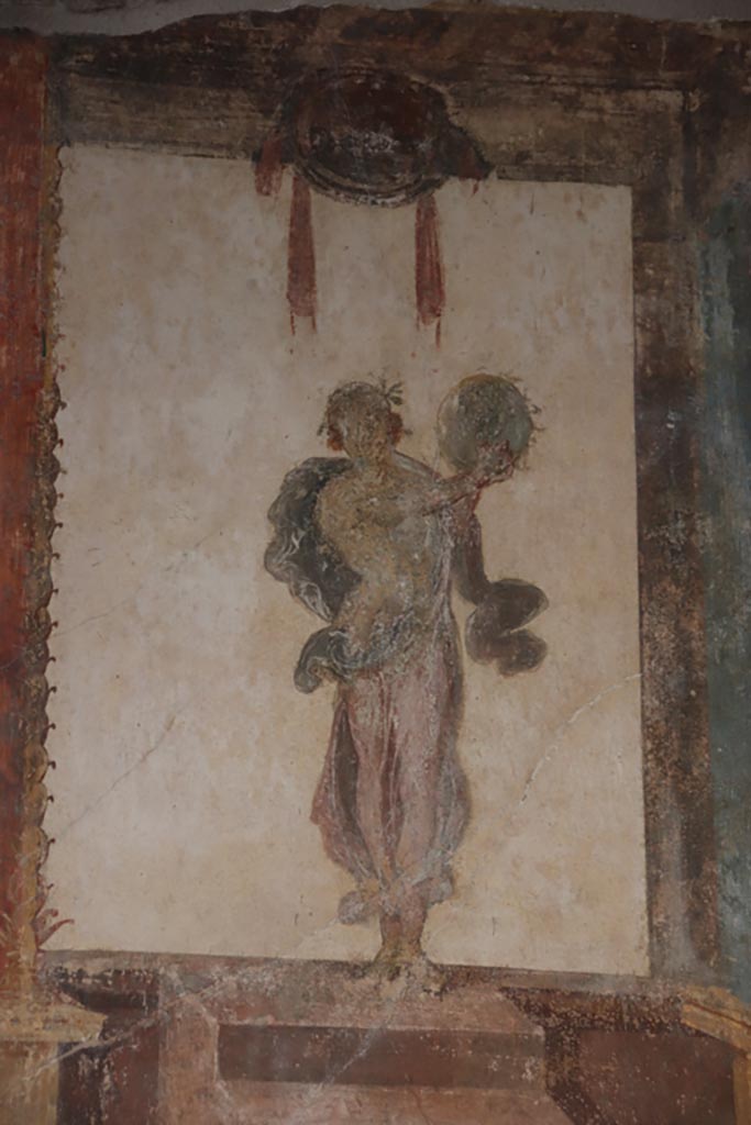 VI.15.1 Pompeii. October 2023. 
Painted figure of Muse Urania, from west end of south wall of oecus. Photo courtesy of Klaus Heese.
