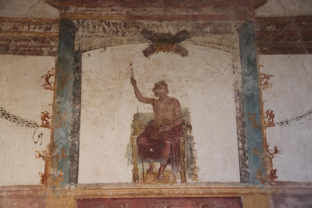 VI.15.1 Pompeii. October 2023. 
Upper centre of west wall of oecus, detail of painted decoration and figure of Zeus. Photo courtesy of Klaus Heese.
