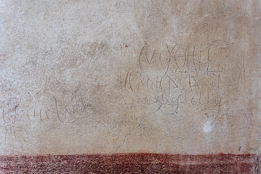 VI.15.1 Pompeii. October 2023. Left hand (south) wall of vestibule with graffiti. Photo courtesy of Johannes Eber.